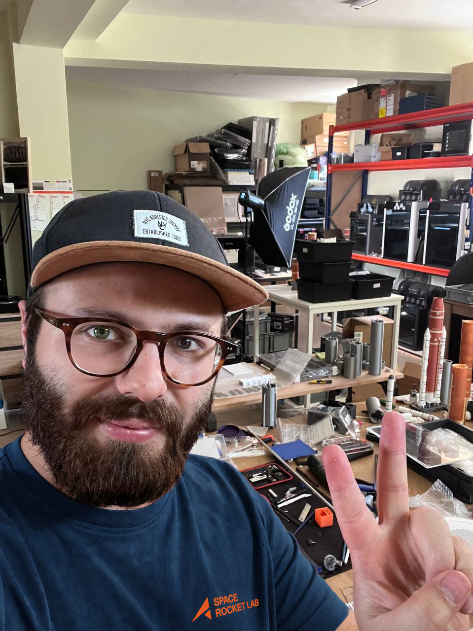 Alex, founder of Space Rocket Lab, in the lab wearing a navy Space Rocket Lab t-shirt