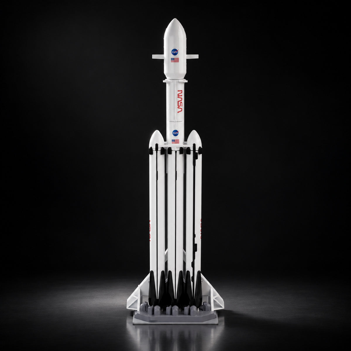 Falcon Heavy scale model on a dark studio background