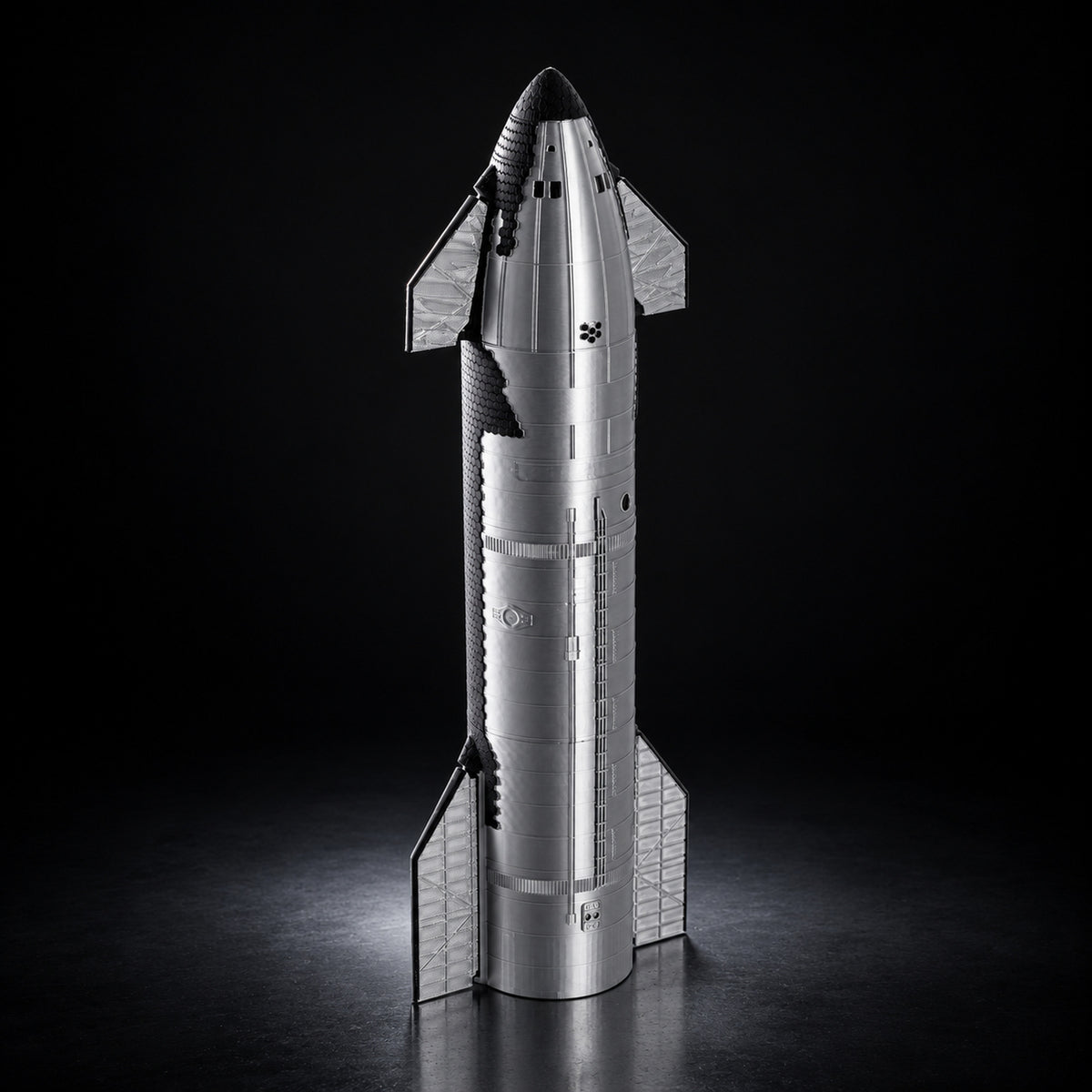 Starship upper stage scale model on a dark studio background