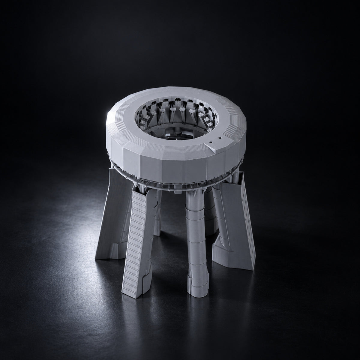 Starship orbital launch mount scale model on a dark studio background