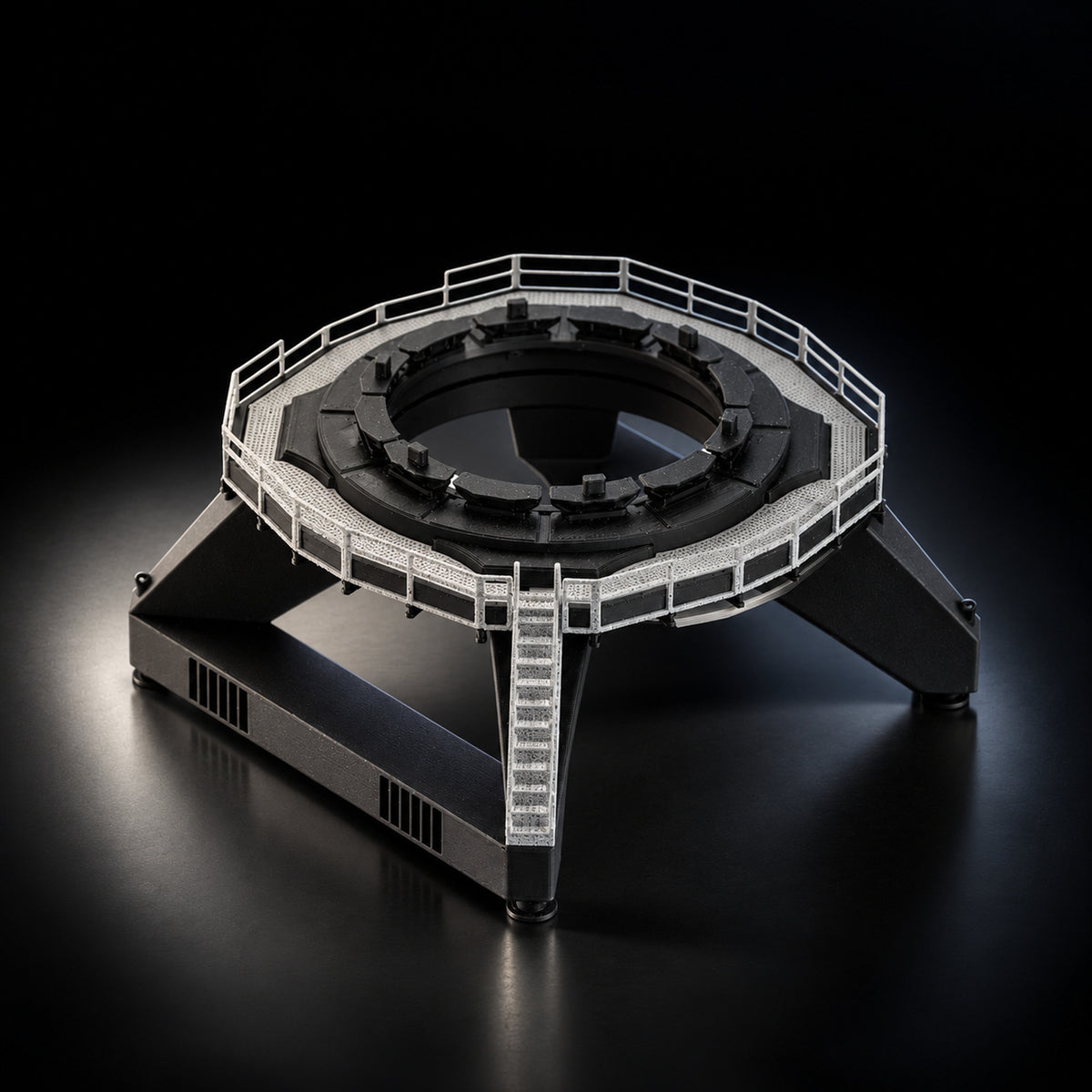 Static fire base mount scale model on a dark studio background