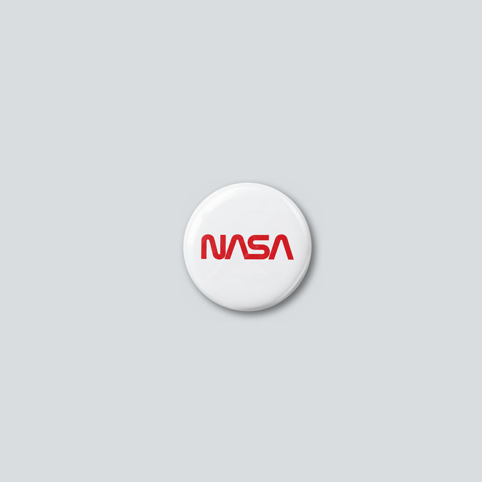 Round 25 mm pin with the red NASA worm logotype on a white face