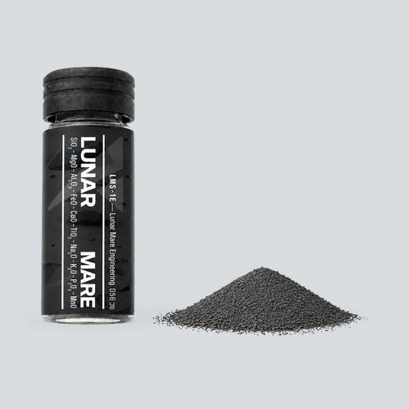Lunar Mare Engineering Grade LMS-1E regolith simulant vial with a small pile of dark grey powder