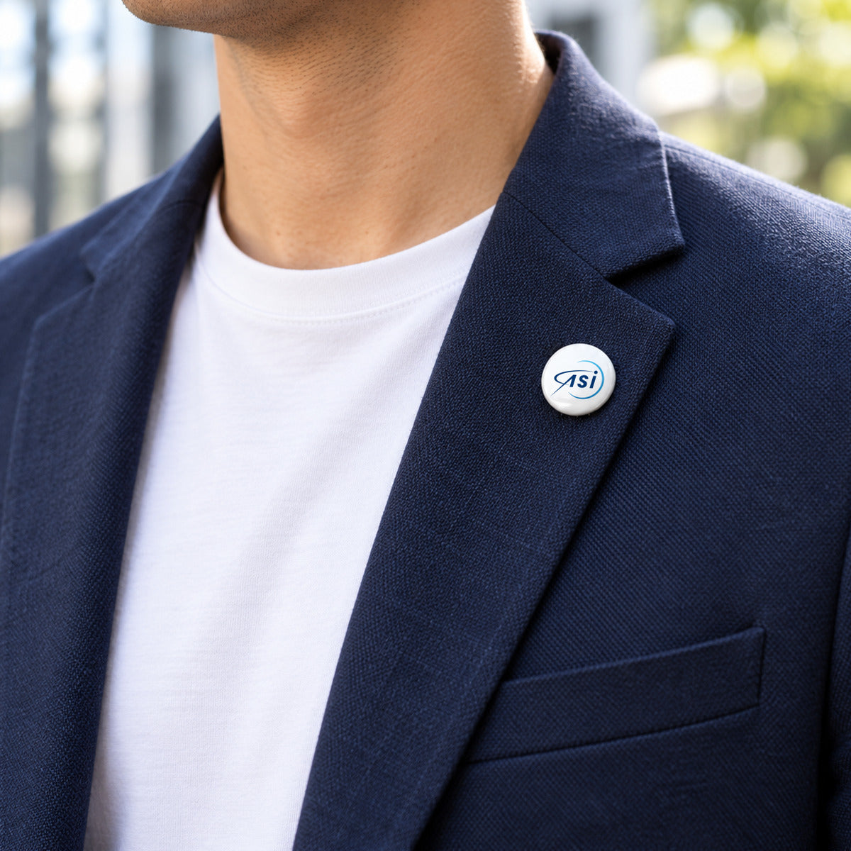 ASI 25 mm pin on the lapel of a navy casual blazer